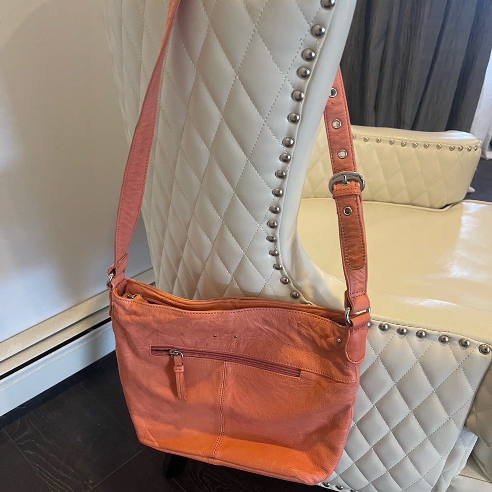 Stone Mountain salmon colored leather bag
